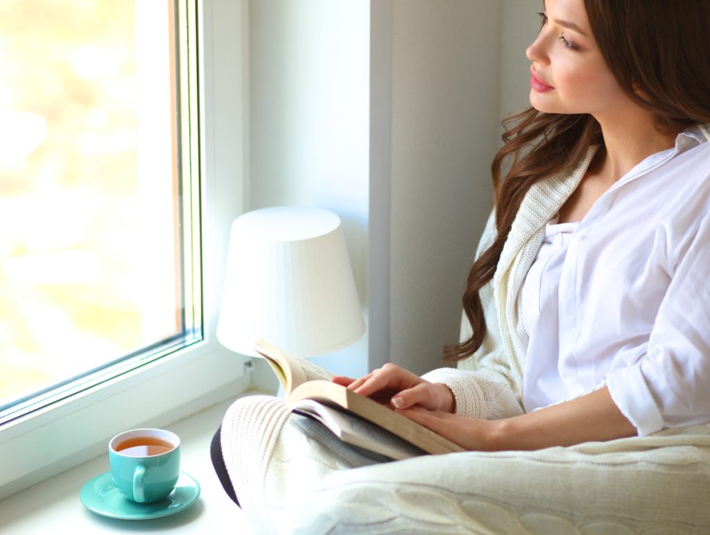 Woman sitting and looking out