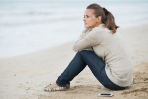 Woman thinking on the beach